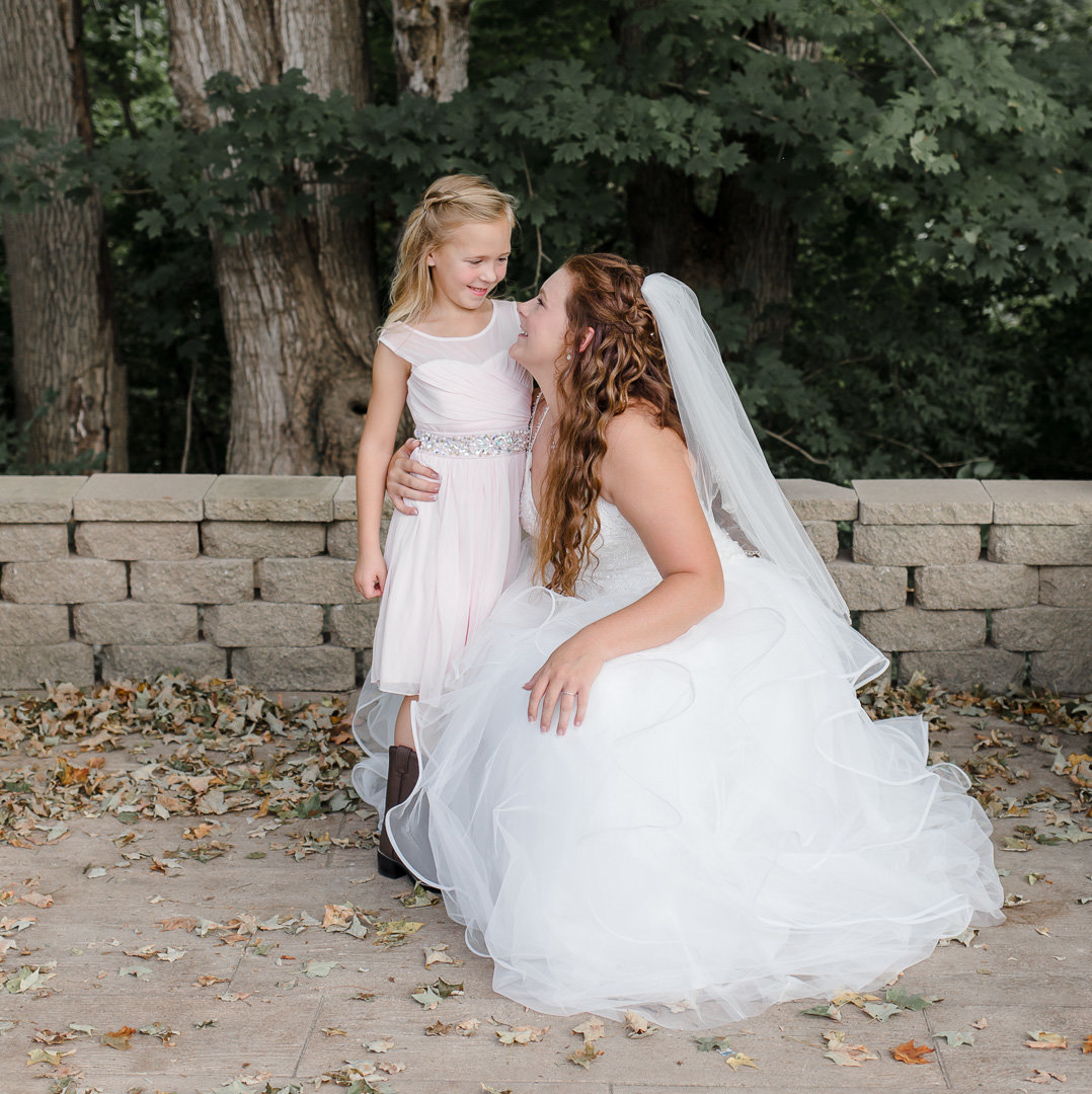 bride and flower girl on her wedding day