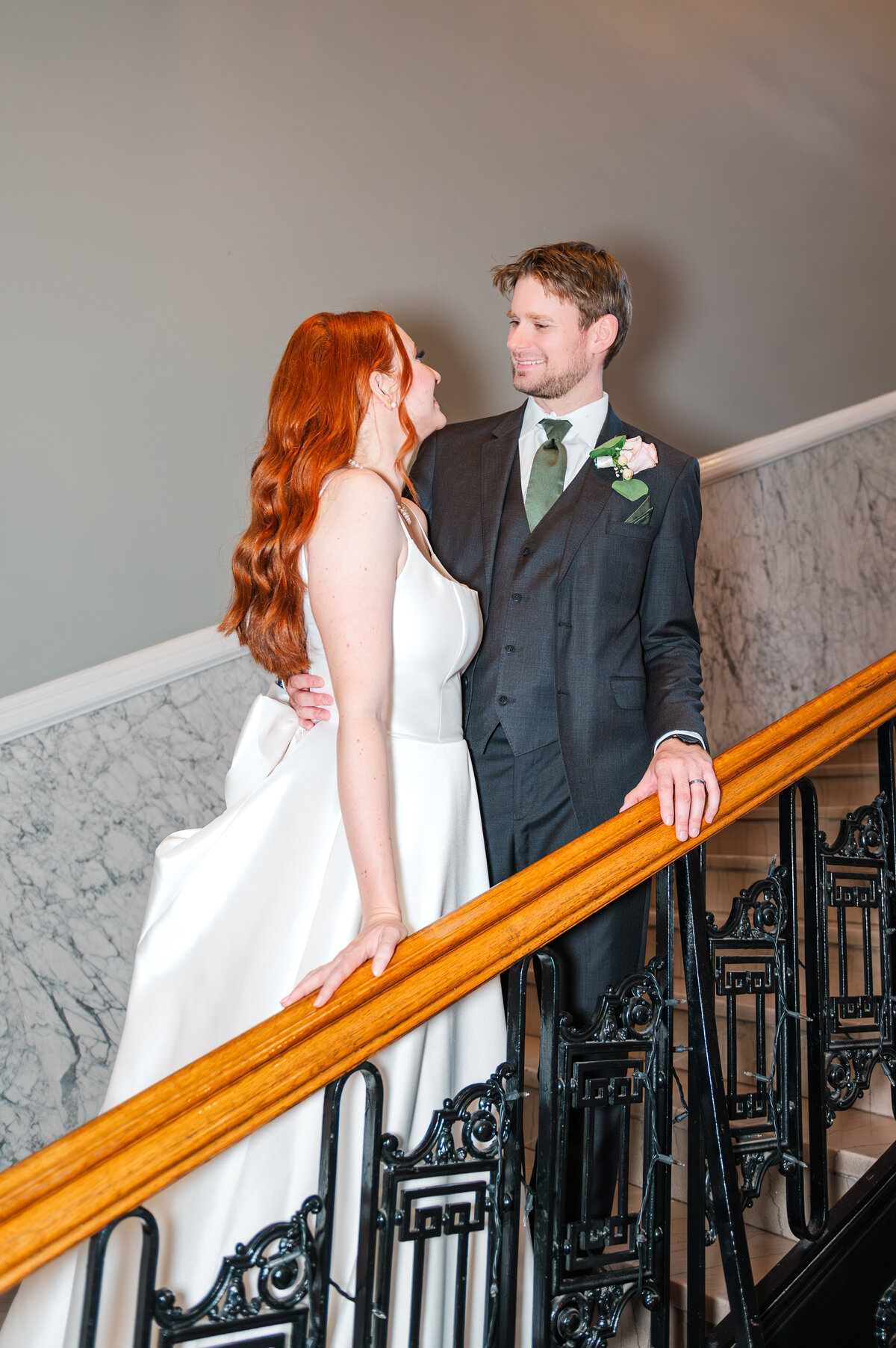 bride and groom on stairs in luxury lexington wedding venue