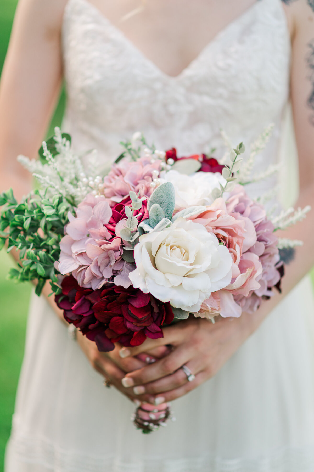 Bride Holding Flower Bouquet on Wedding Day