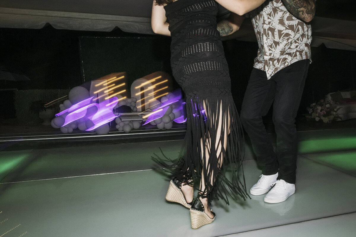 Photo of black fringe dress on dance floor in private backyard party by Mira Park Photography NY based wedding photographer