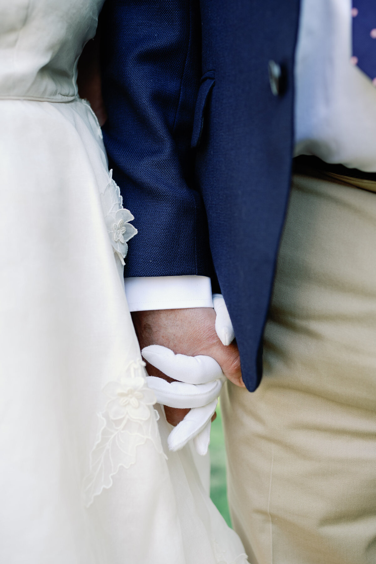 couple holds hands at wedding