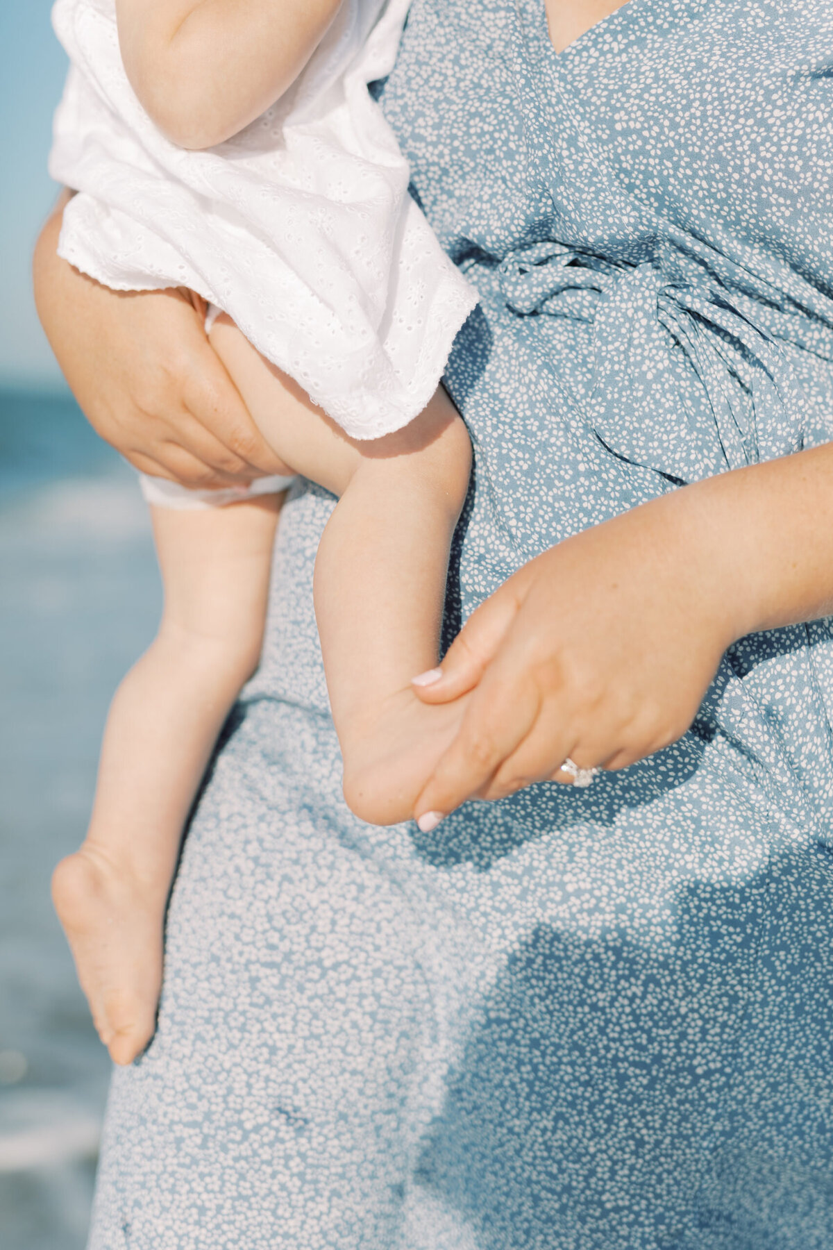 A mom carrying her baby, embodying the nurturing connection and balance of holistic wellness, promoting care, love, and natural well-being for both mother and child.