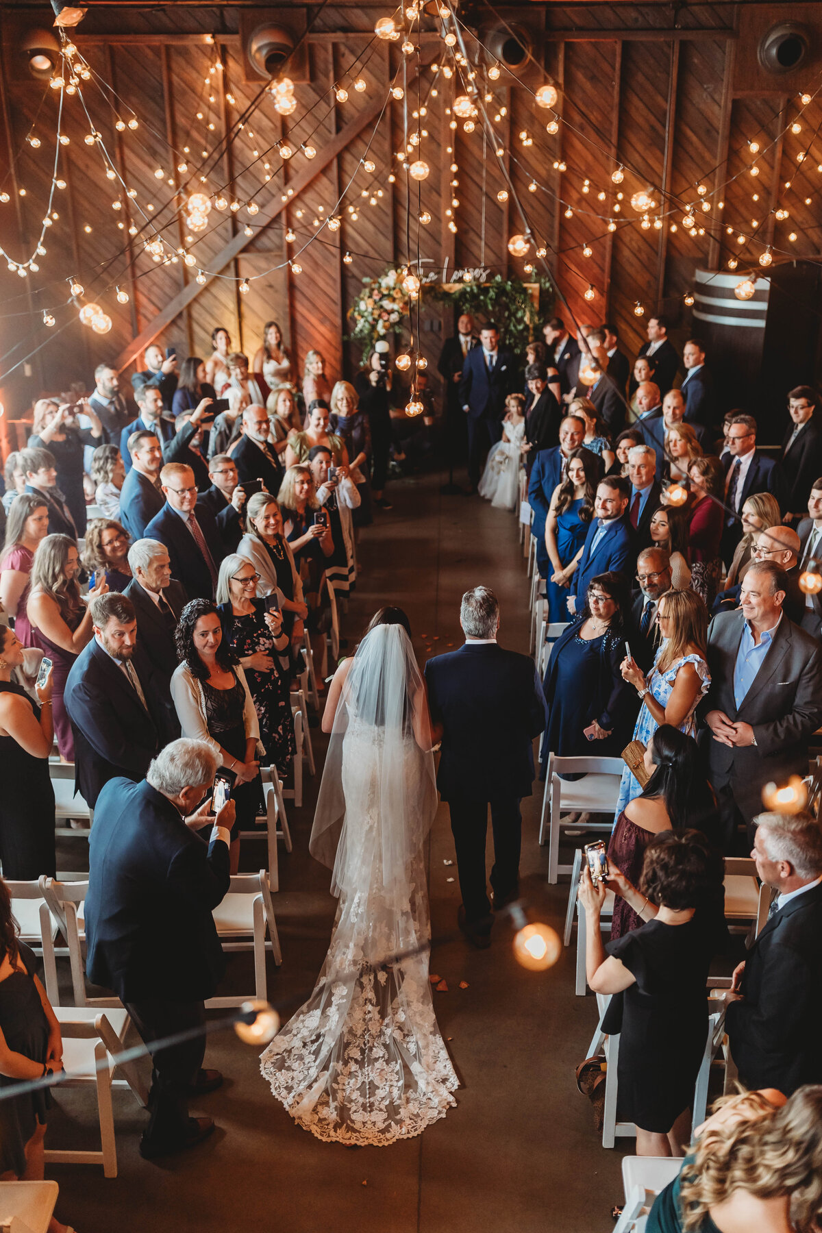 wedding-ceremony-string-bulb-lighting-bride-father-