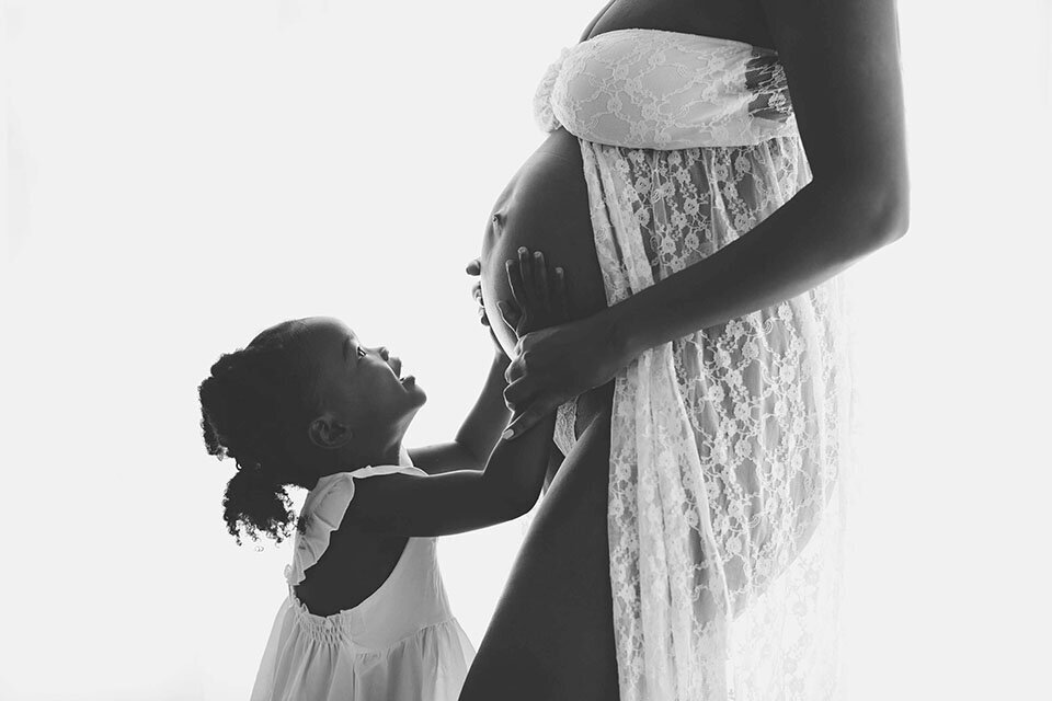 Black and white DC maternity portrait of woman and her daughter