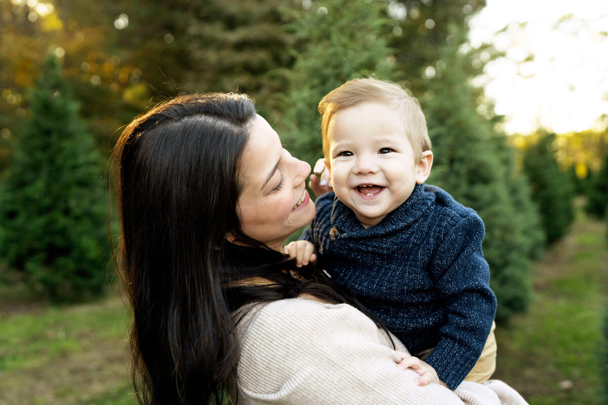 Mother holding baby boy in a tree of fields by Atlanta family photographer Leanne Hymes