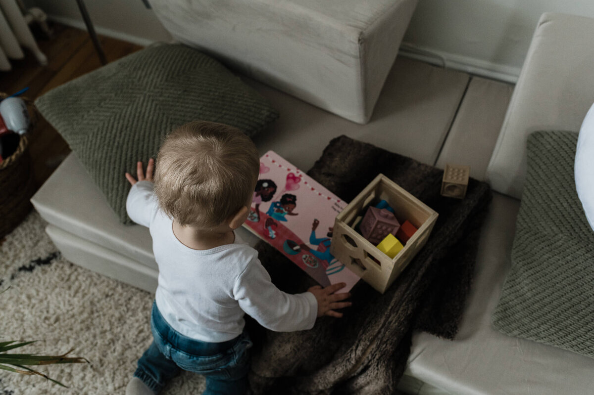 Child playing on living room floor.