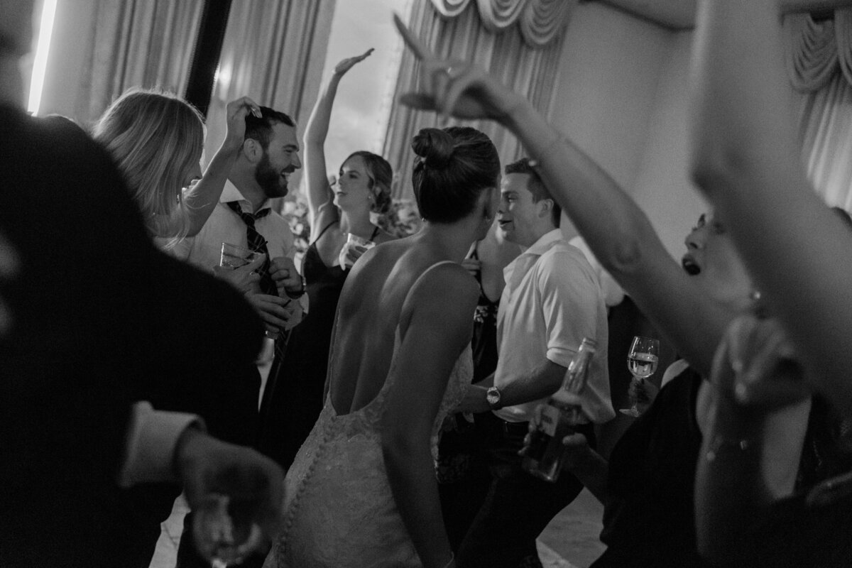 Guests dance and celebrate at wedding reception captured by Philadelphia wedding photographer.