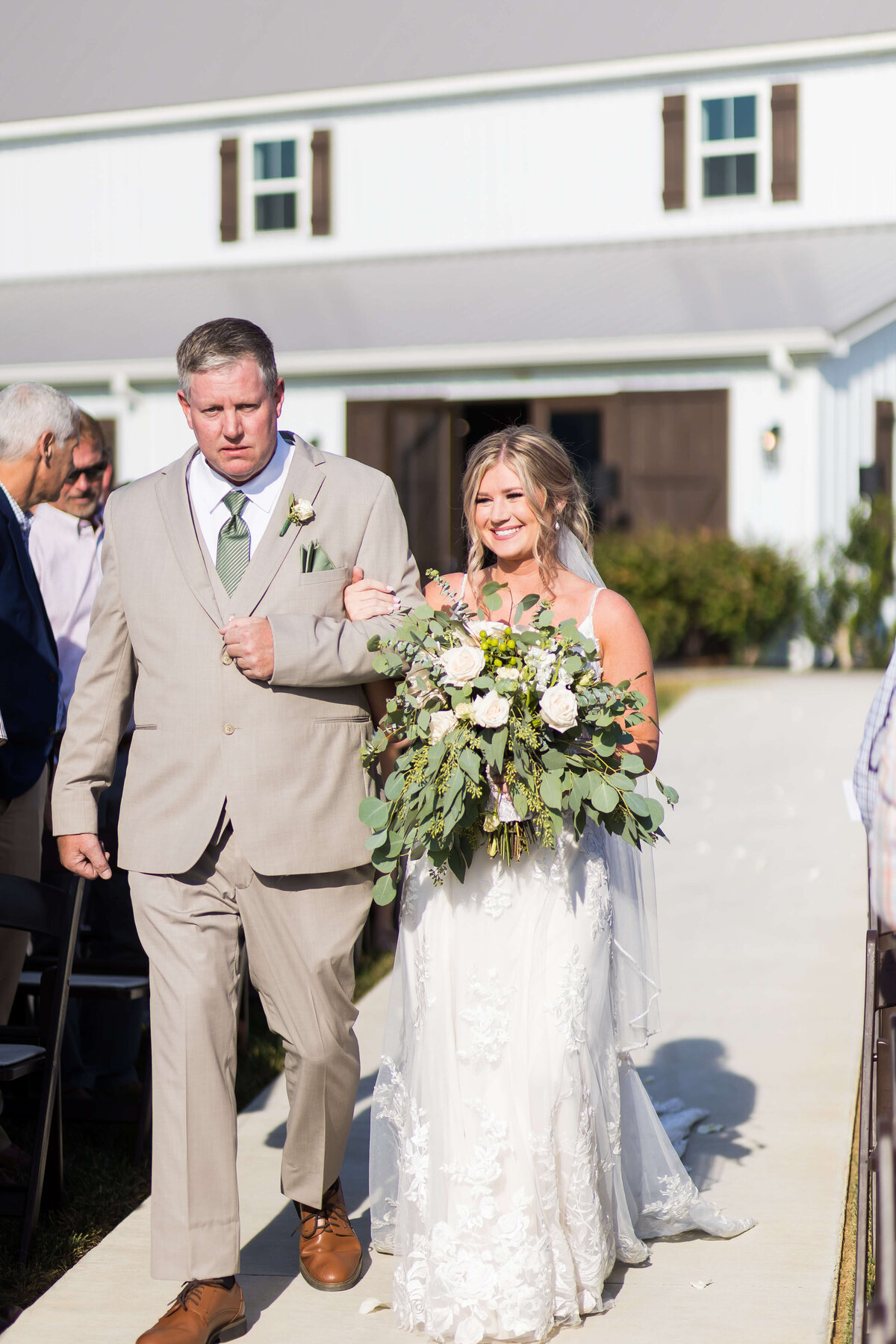 Bride walking down the aisle with father at  The Barn at White Oaks, Murray, Kentucky