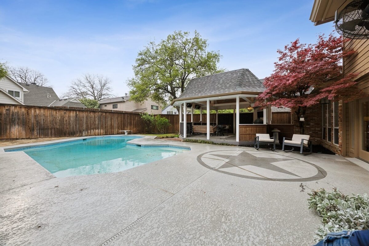 17828_cedar_creek_canyon_dallas_tx_backyard_pool_with_star_patio_and_maple_tree_-_haven_realty_group