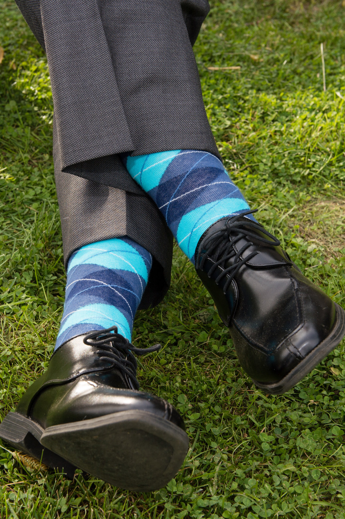 argyle socks and shiny shoes feet crossed color photo
