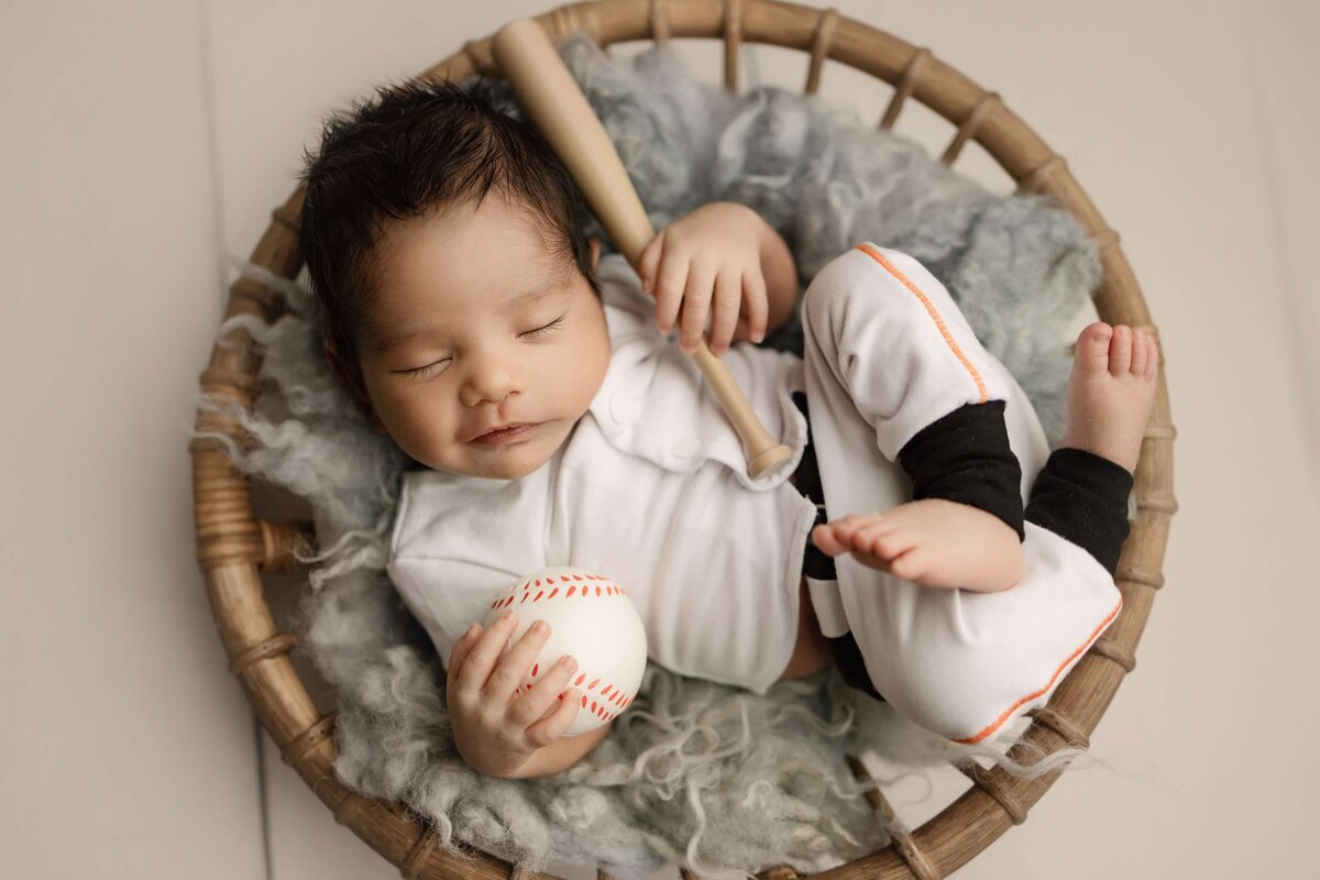 Baseball themed newborn portait in Denver Colorado