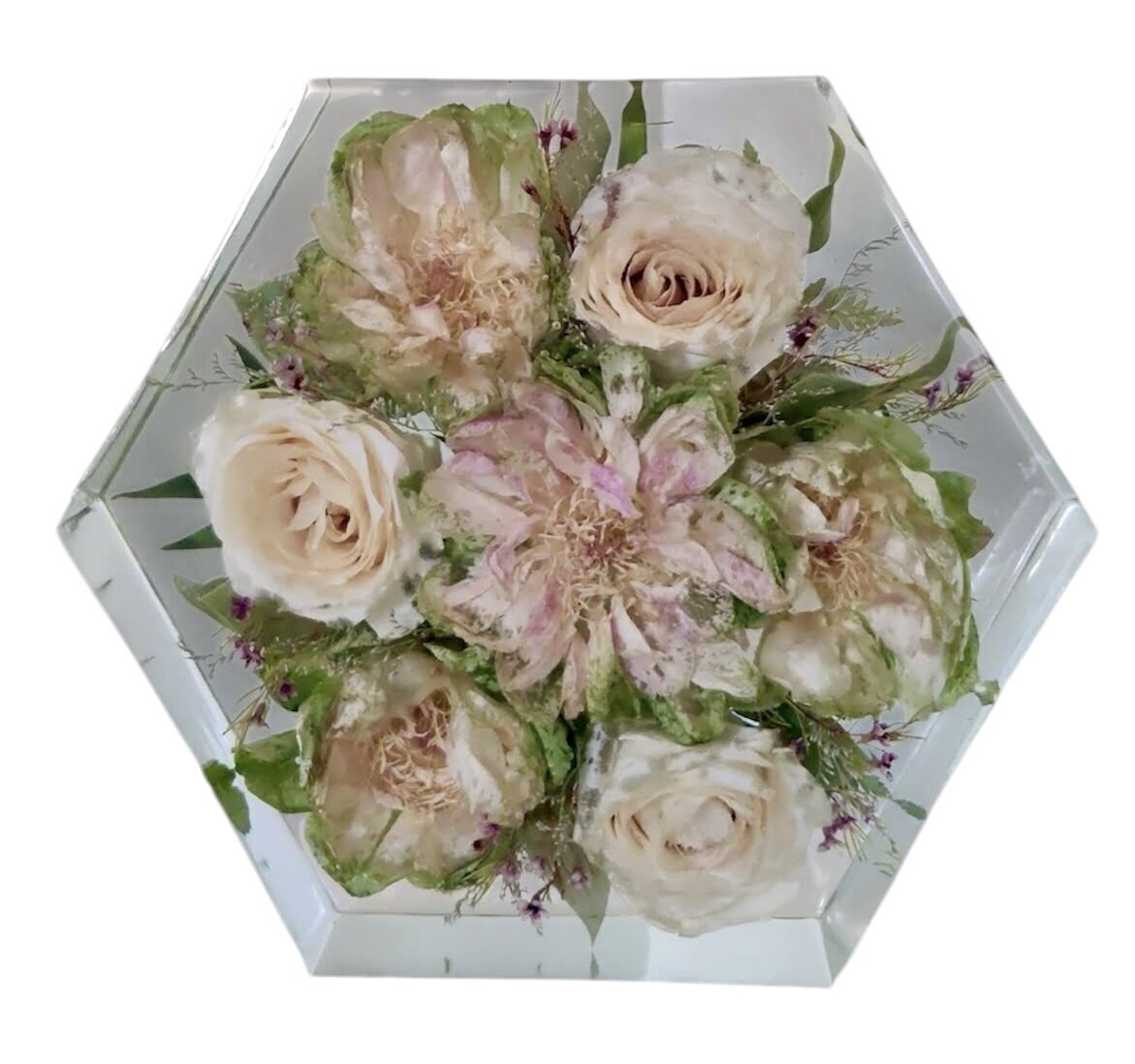 hexagon resin block with light pink and cream wedding flowers preserved as a family heirloom