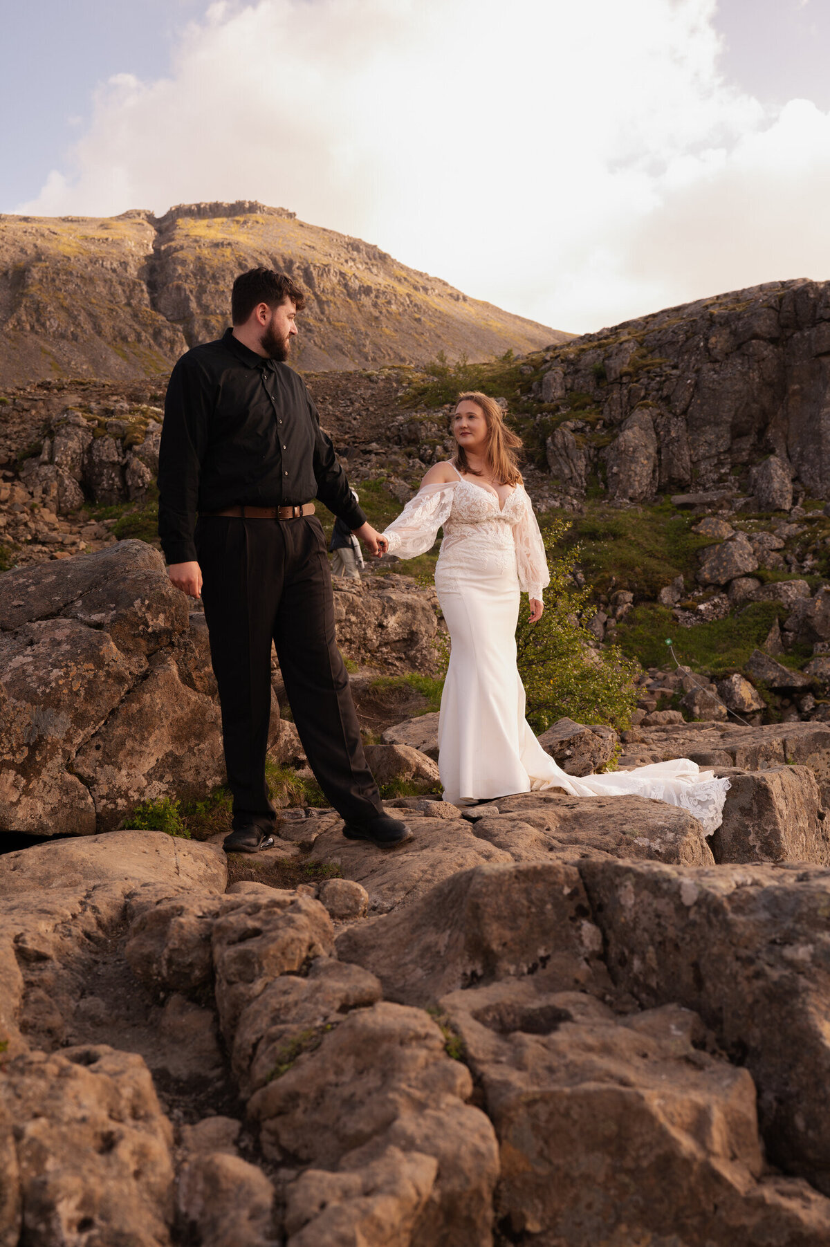 Portraits of a bride and groom during their Iceland elopement at Dynjandi Waterfall.