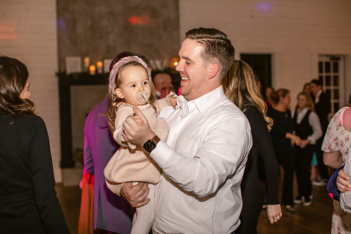Fort Worth wedding photographer captures dad dancing with toddler girl at reception