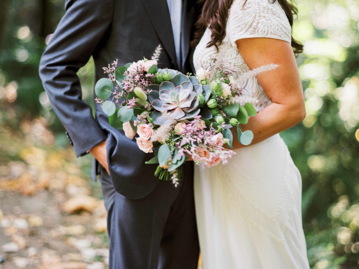 Textured bridal bouquet with  a large succulent designed by Flora Nova Design