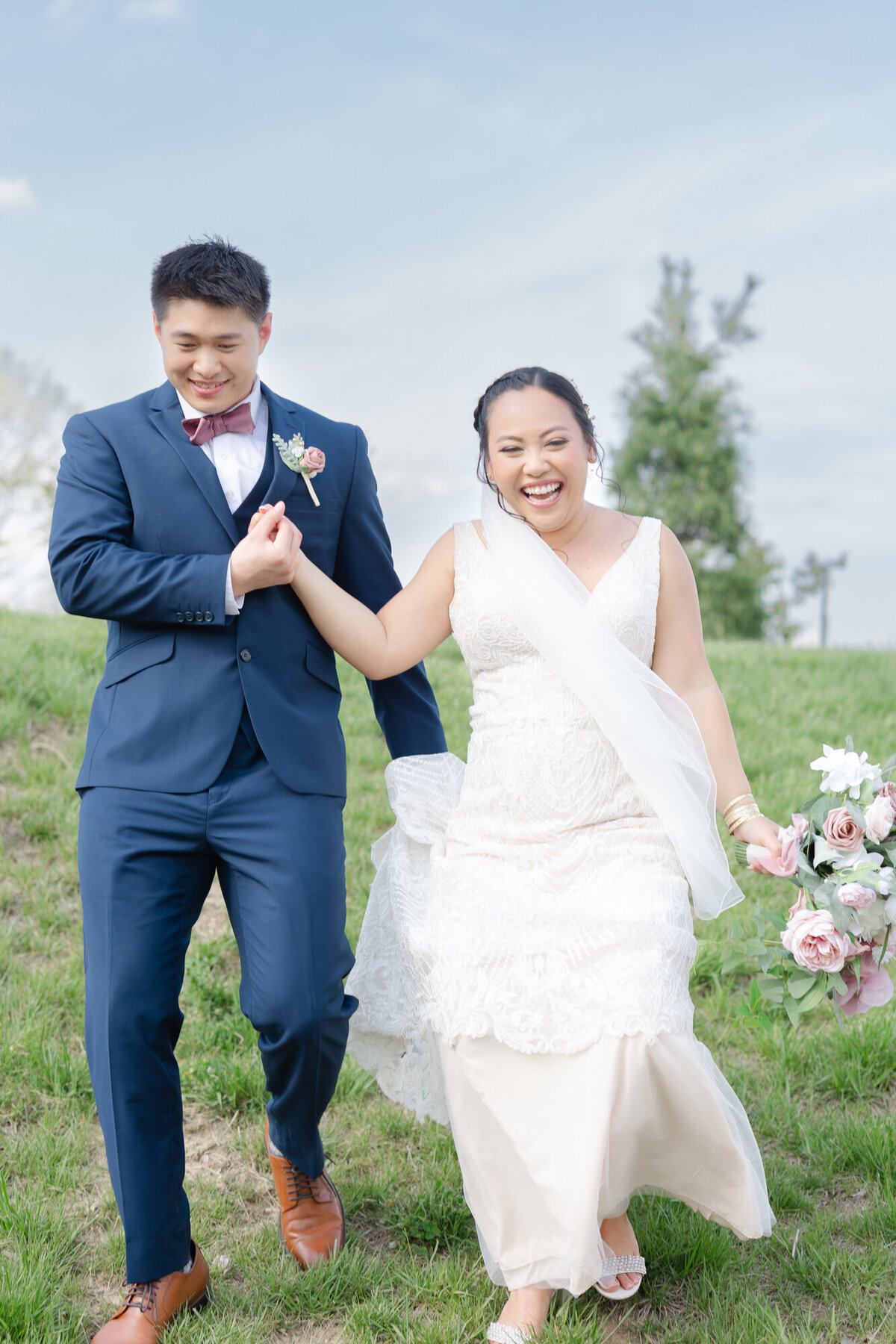 bride and groom walking on their wedding day at Retreat 21 in Ohio