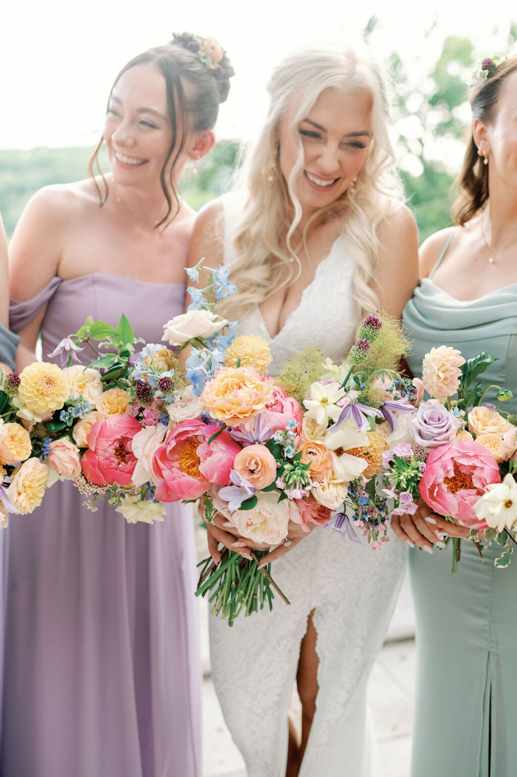 Bright and colorful bridal bouquet for summer wedding. Fun colorful wedding colors in peach, coral, lavender, and blue. Fun wedding bouquets with peonies and wildflowers. Colorful and classic summer wedding design for Tennessee wedding. Design by Rosemary & Finch Floral Design in Nashville, TN. 