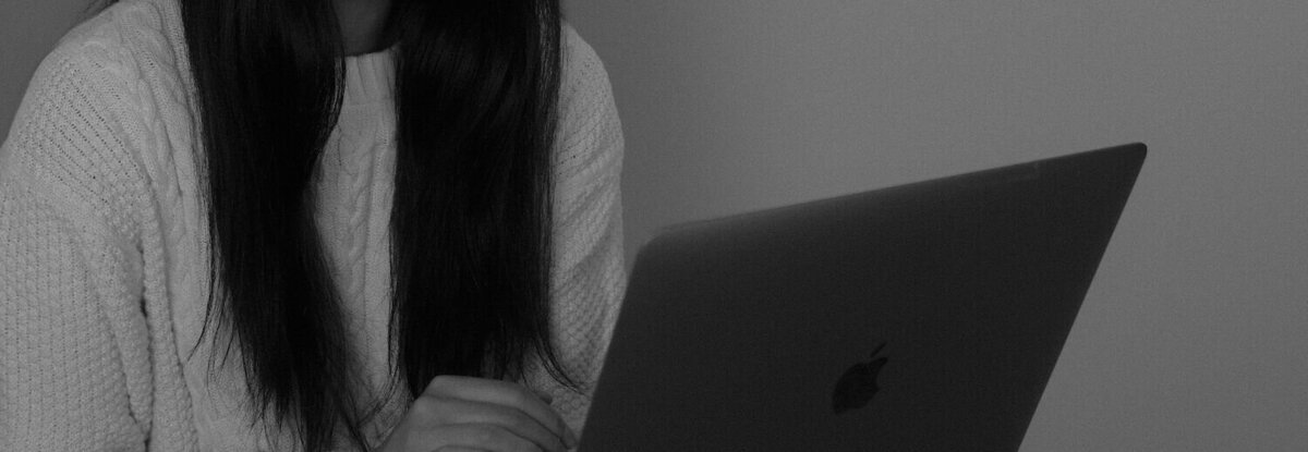 Women looking at laptop as she works