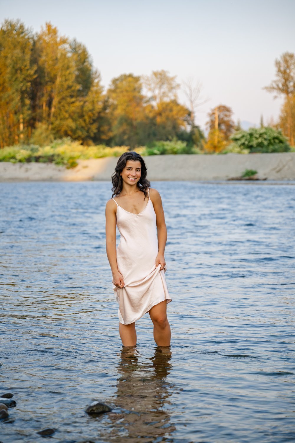 monroe senior standing in skykomish river
