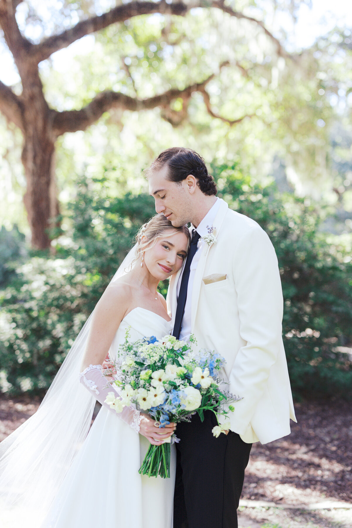 Bride smiles at camera during Charleston wedding portraits
