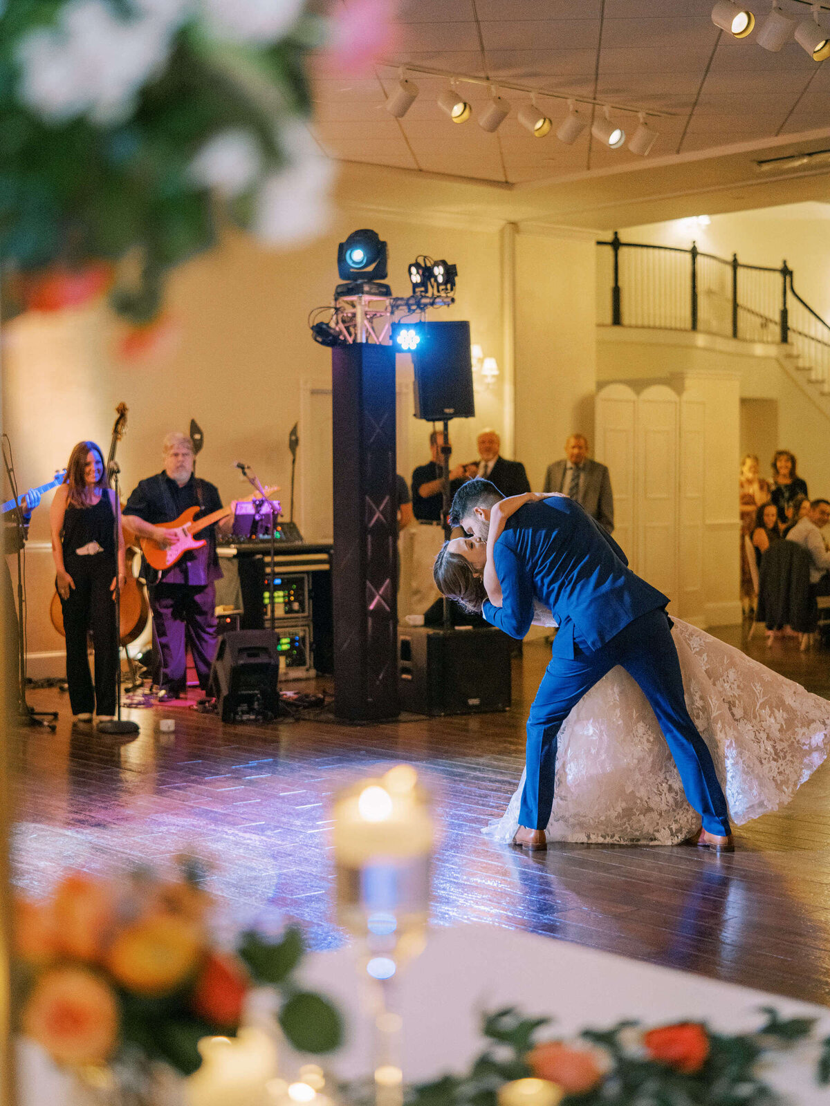 Husband dips his new bride wearing Monique Lhuillier wedding gown