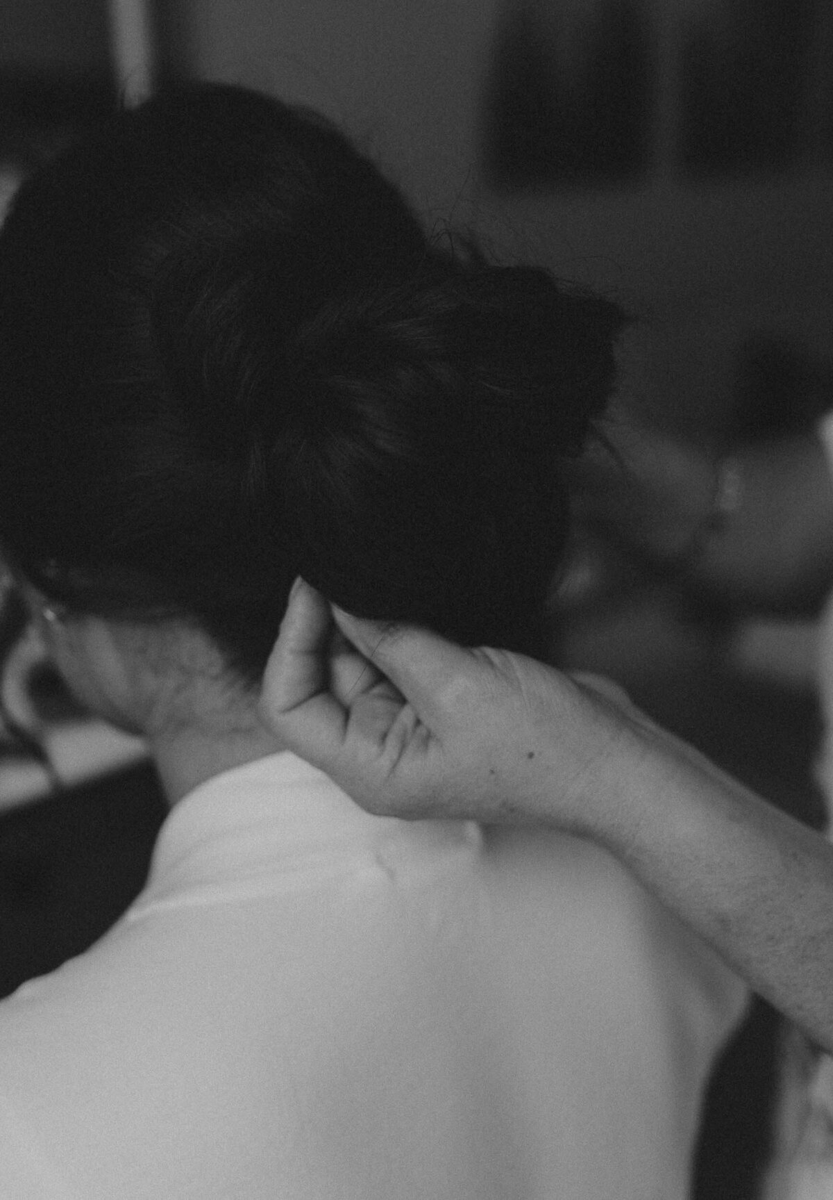 Mother of the Bride holding the bride's hair during a Destination Wedding - Bozeman, Montana