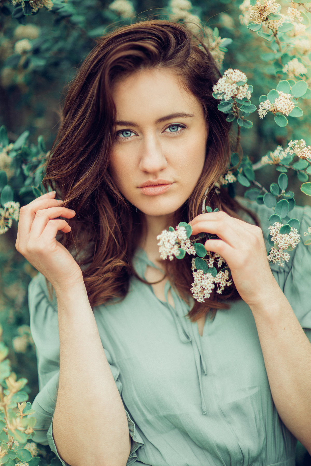 Portrait Photo Of Young Woman In Green Dress Holding White Flowers Los Angeles
