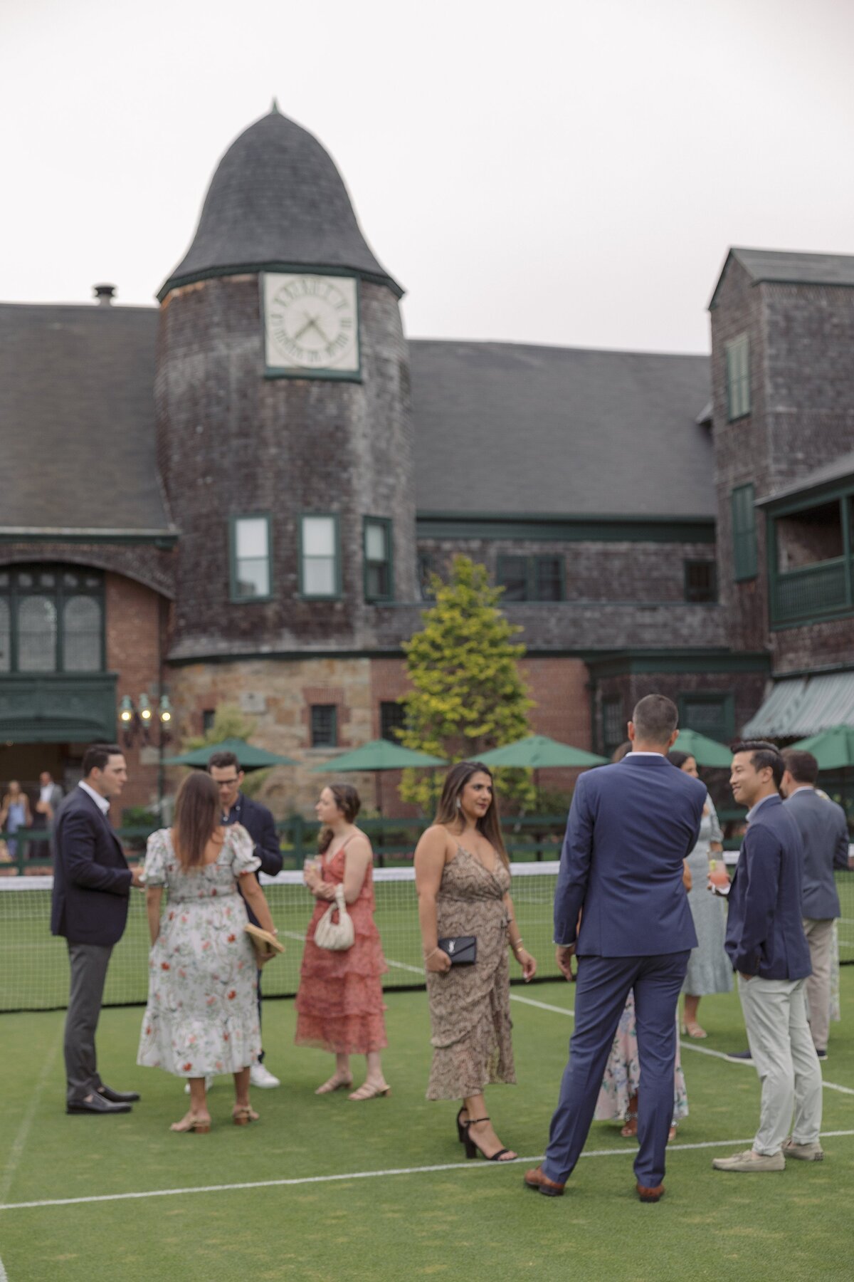 Guests mingle on lawn at the Tennis Hall of Fame in Newport.