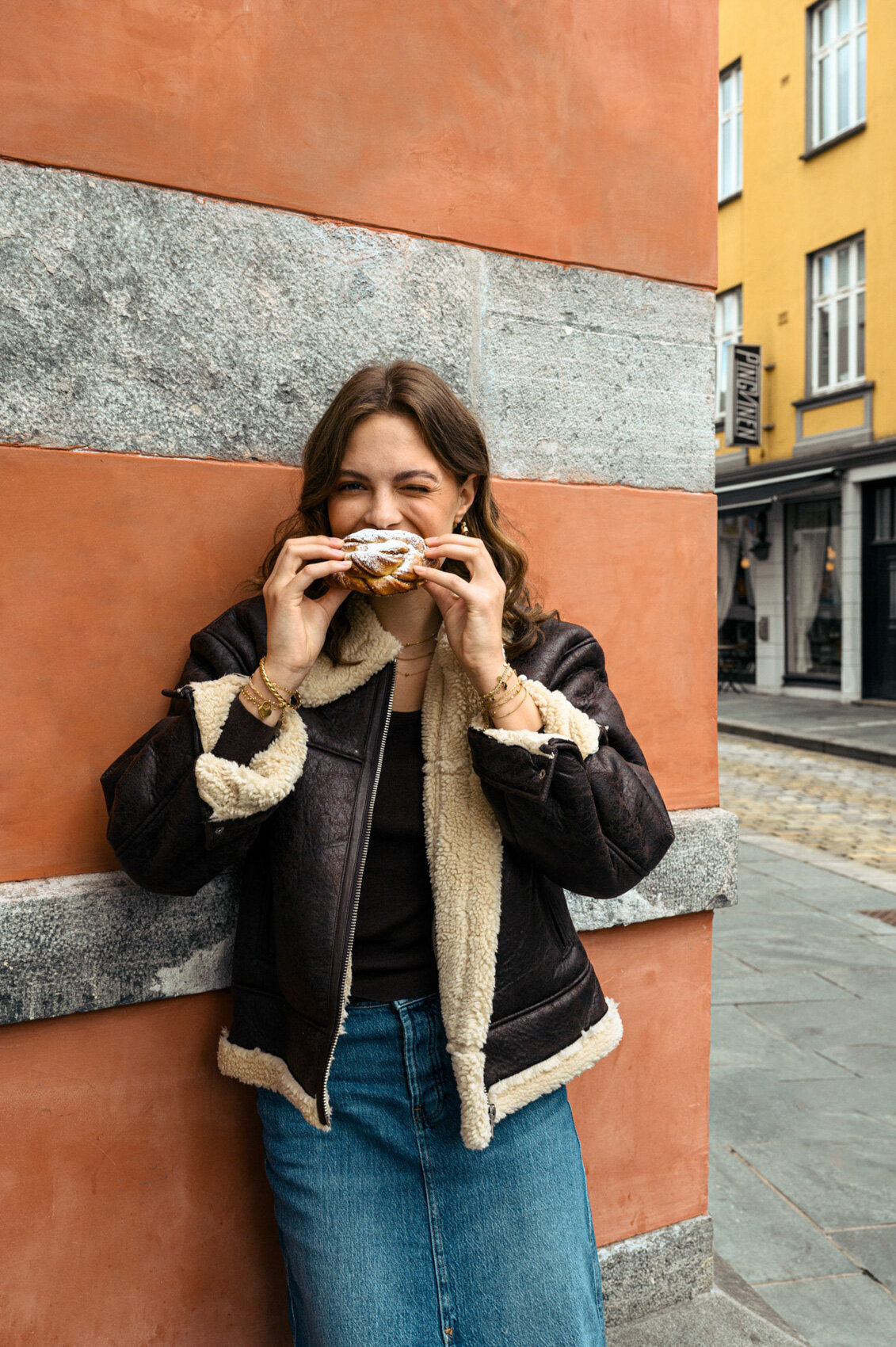 Close-up detail of jewellery photoshoot in city in Norway with cinnamon roll