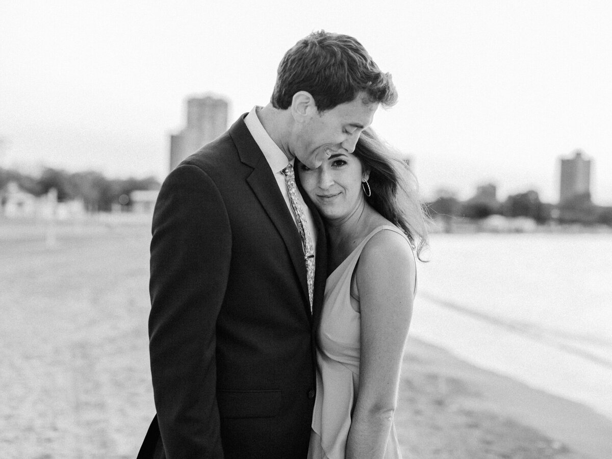 A black and white engagement photo taken at Chicago's North Avenue Beach