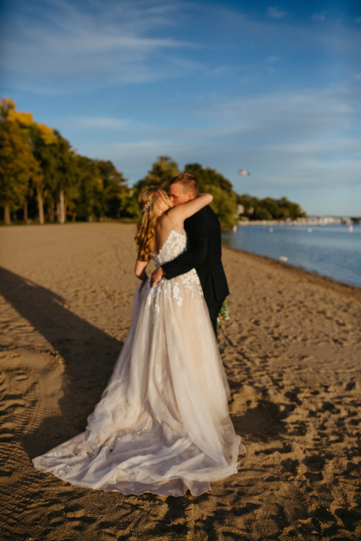 bride-and-groom-kissing-on-beach