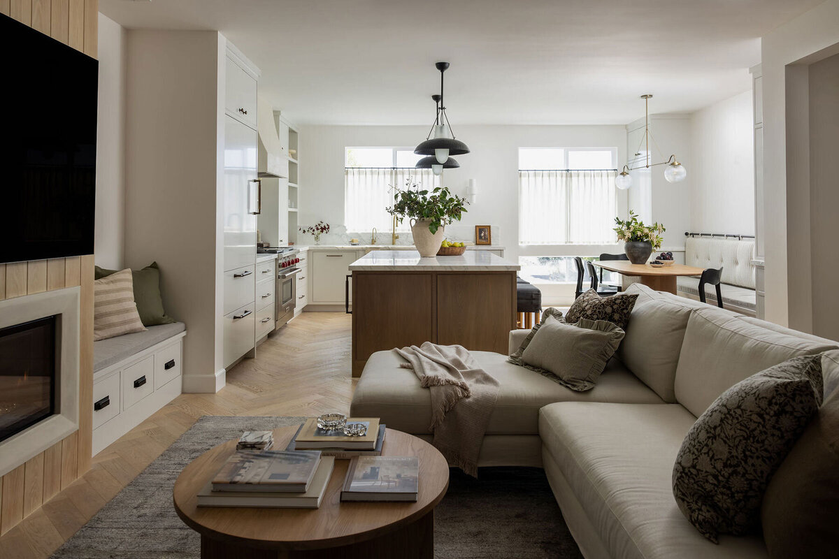 Contemporary Coastal California living room with warm woods and neutral palette in Costa Mesa