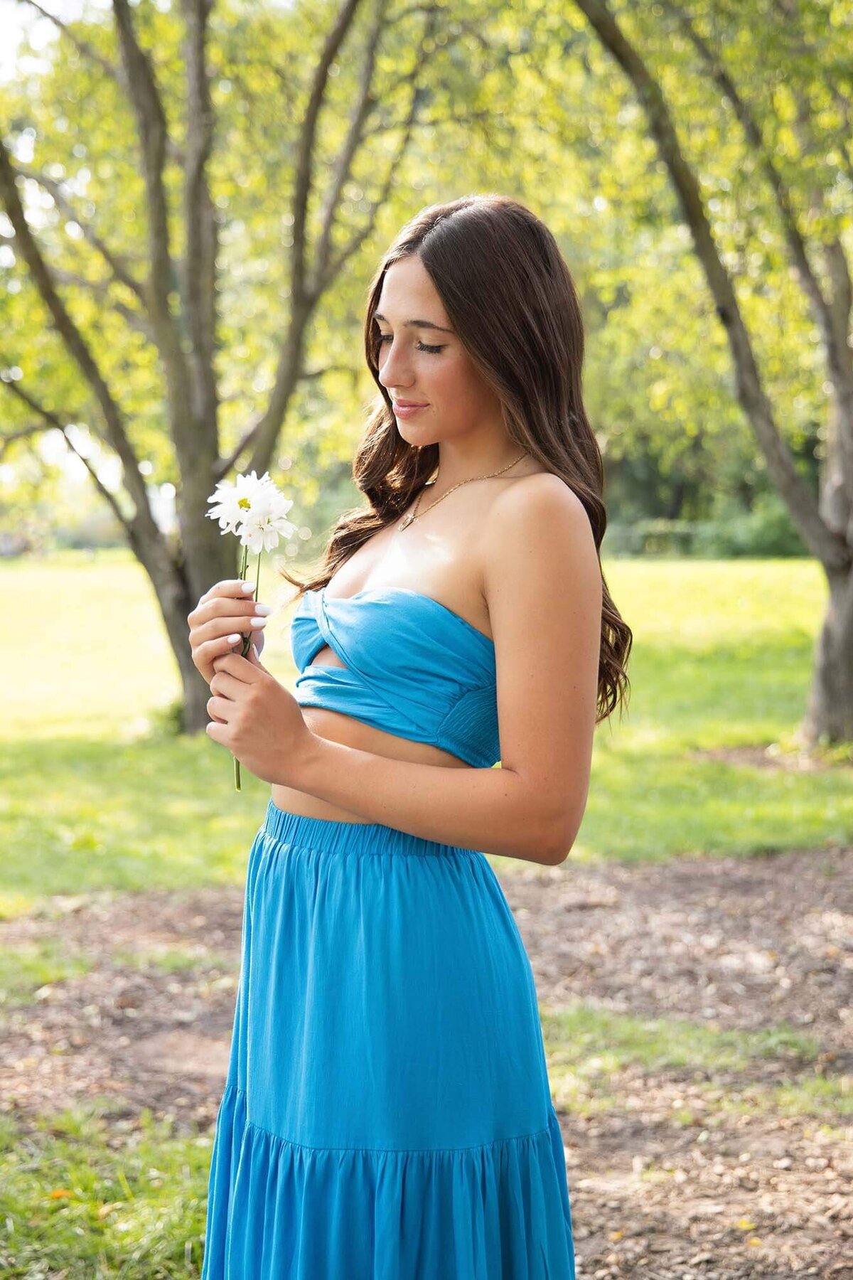 soft-smiling-senior-girl-in-garden