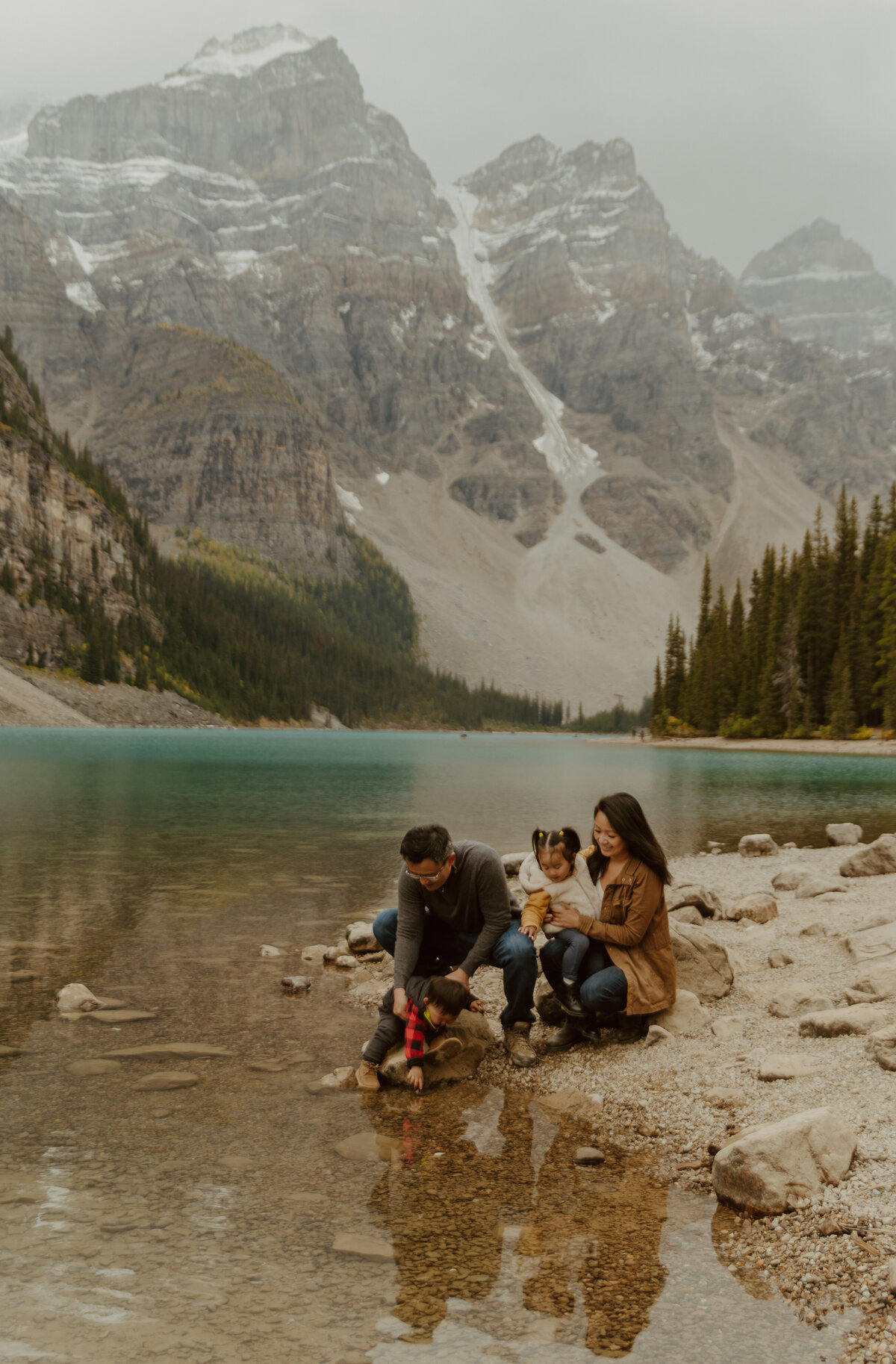 family enjoying views at Moraine Lake, Alberta