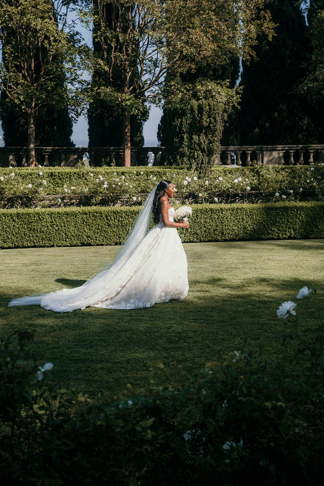 Outdoor Wedding Photography of bride walking down the aisle at Greystone Mansion in Los Angeles.