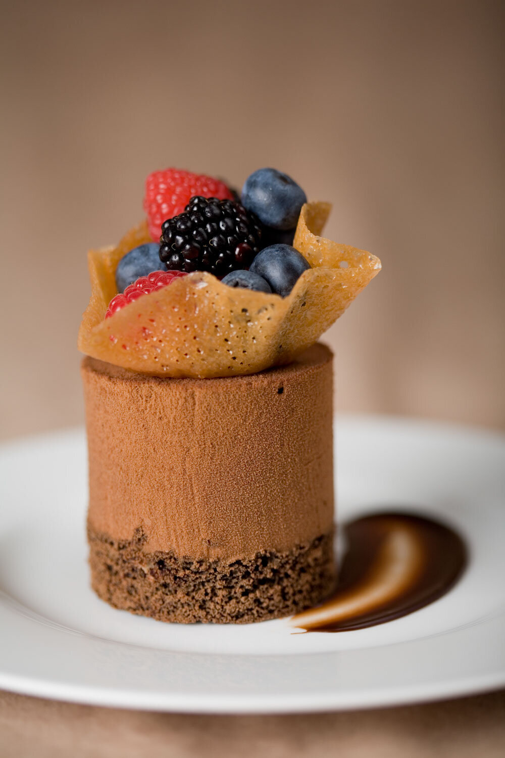 Chocolate mousse dessert topped with berries