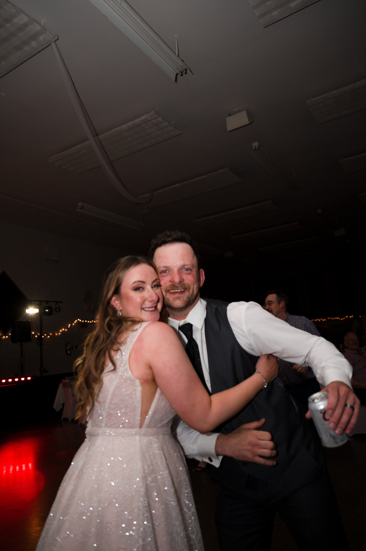 bride and groom hug on the dance floor