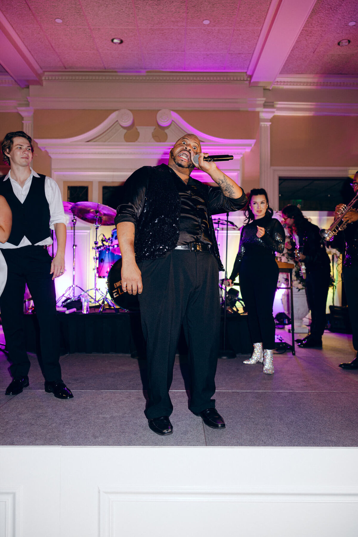 A wedding photo of the band during the wedding reception
