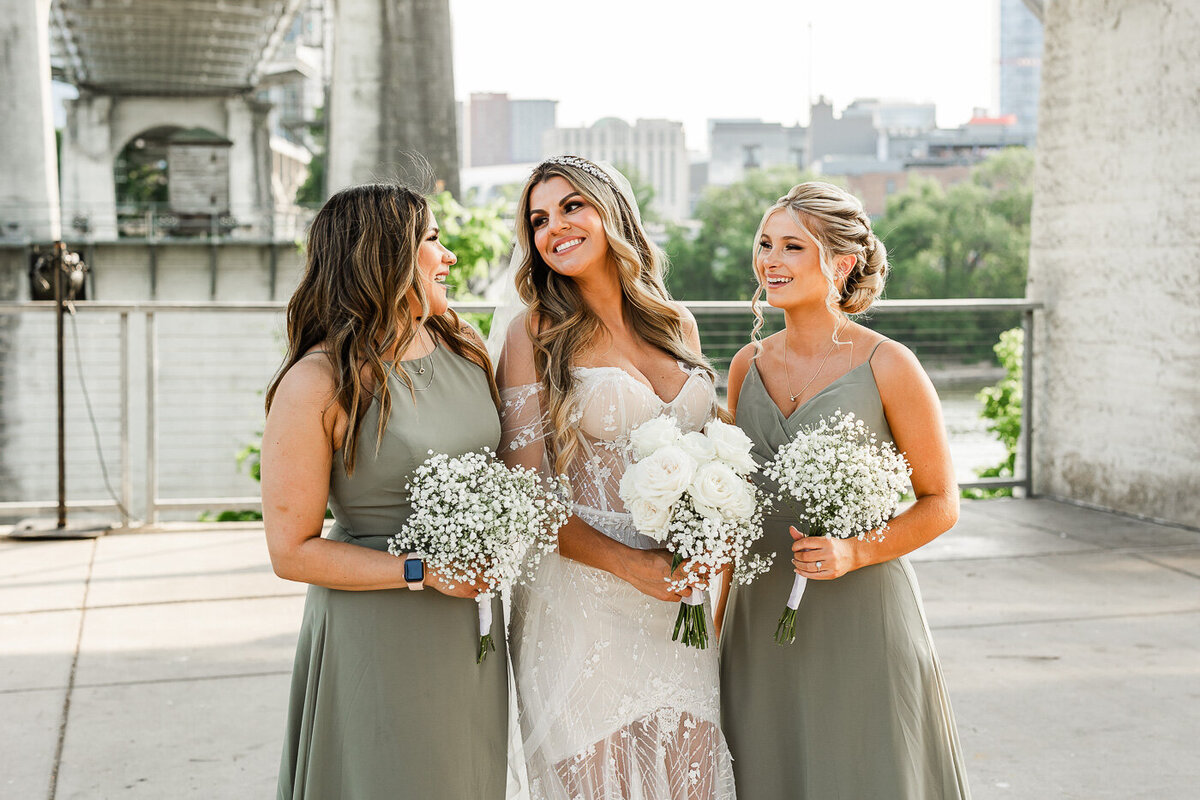 Bride laughing with her bridesmaids at The Bridge Building in Downtown Nashville
