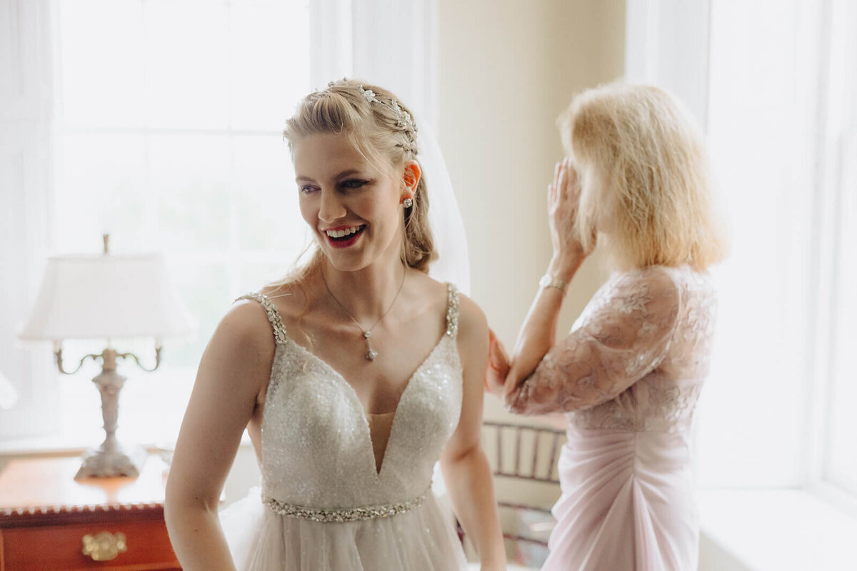 Bride getting ready before wedding at Mansion at Keuka Lake, NY