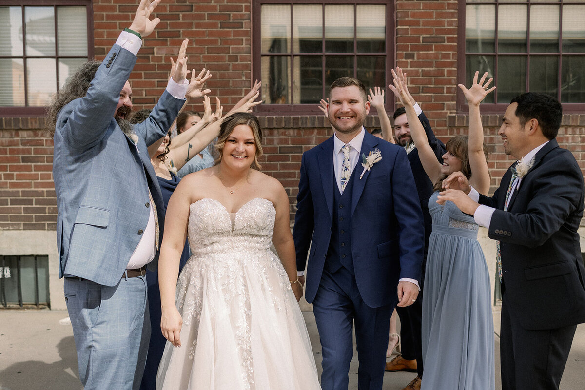Bride and groom with their bridal party on their wedding day in Denver Colorado.