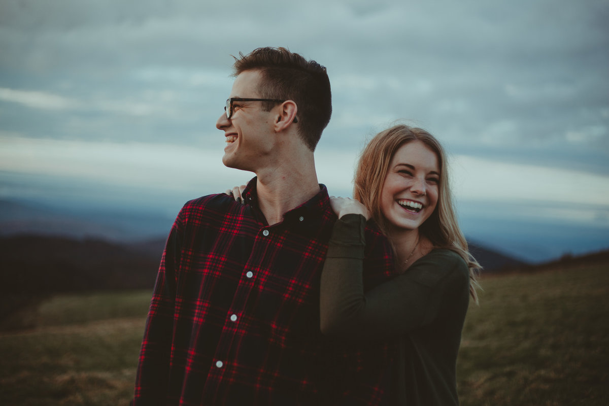 Couple laughing on mountains