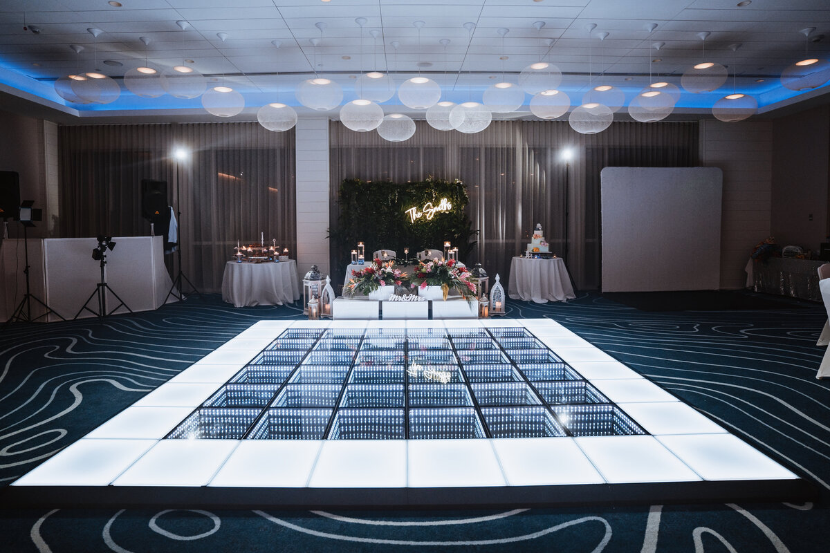 reception setup with LED dance floor in hotel ballroom
