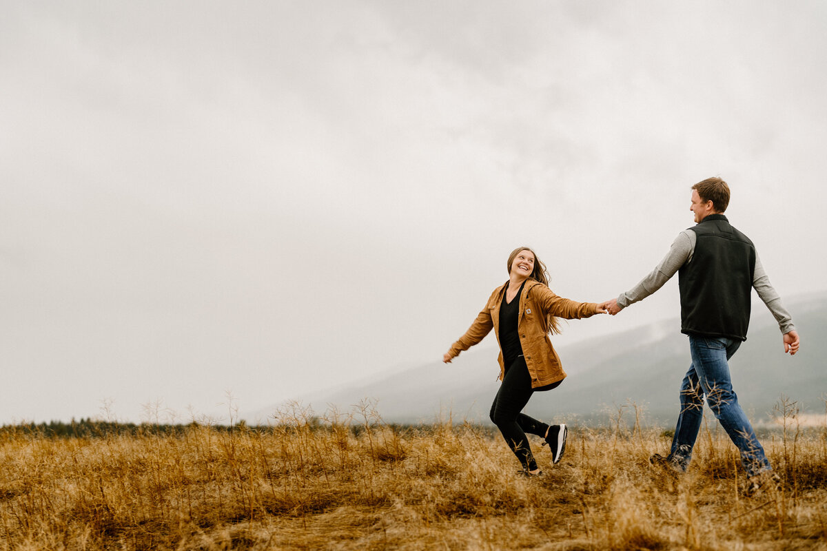 couple runs in foggy field