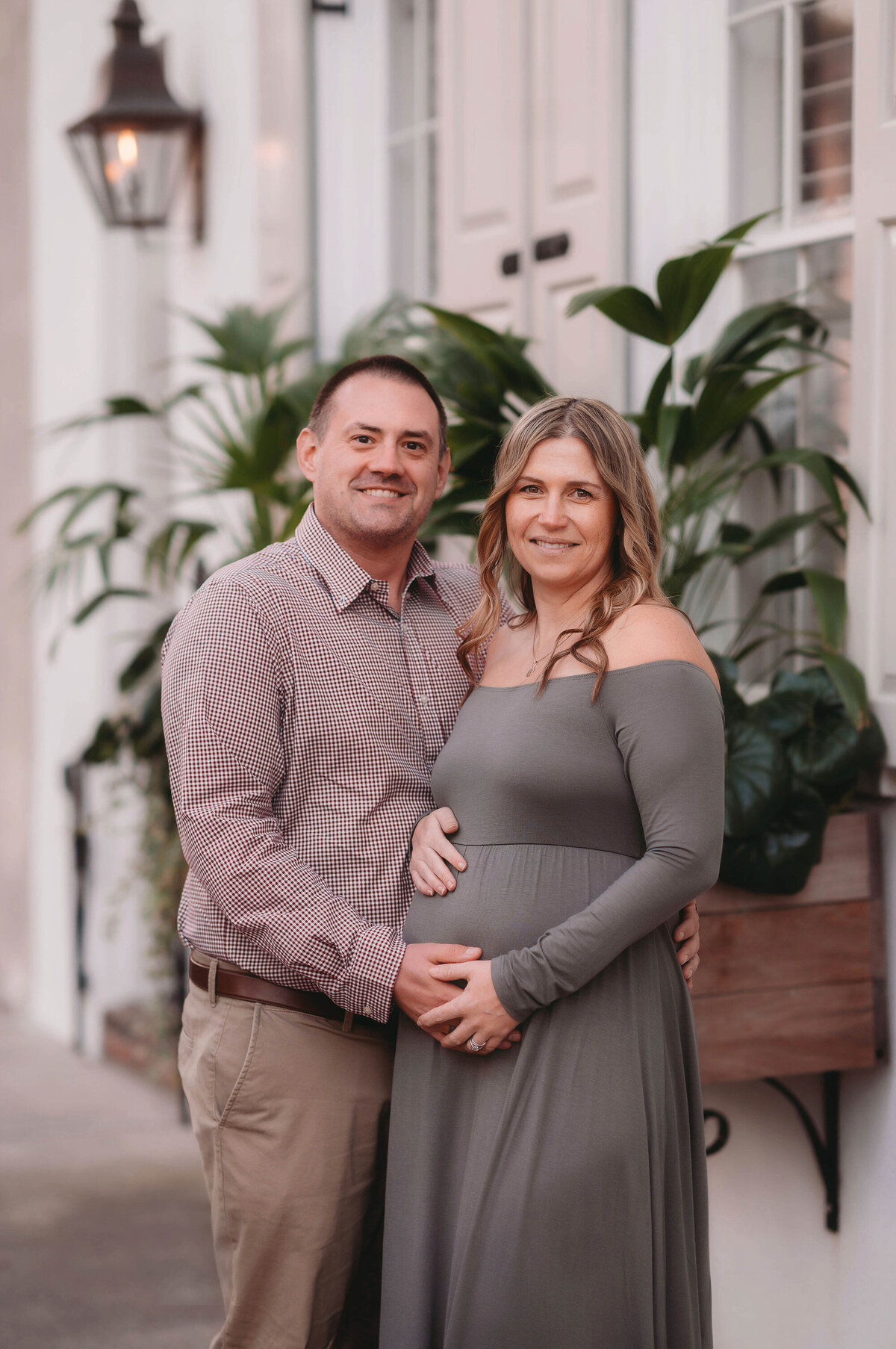 Couple poses for Maternity Pictures in Charleston, South Carolina.