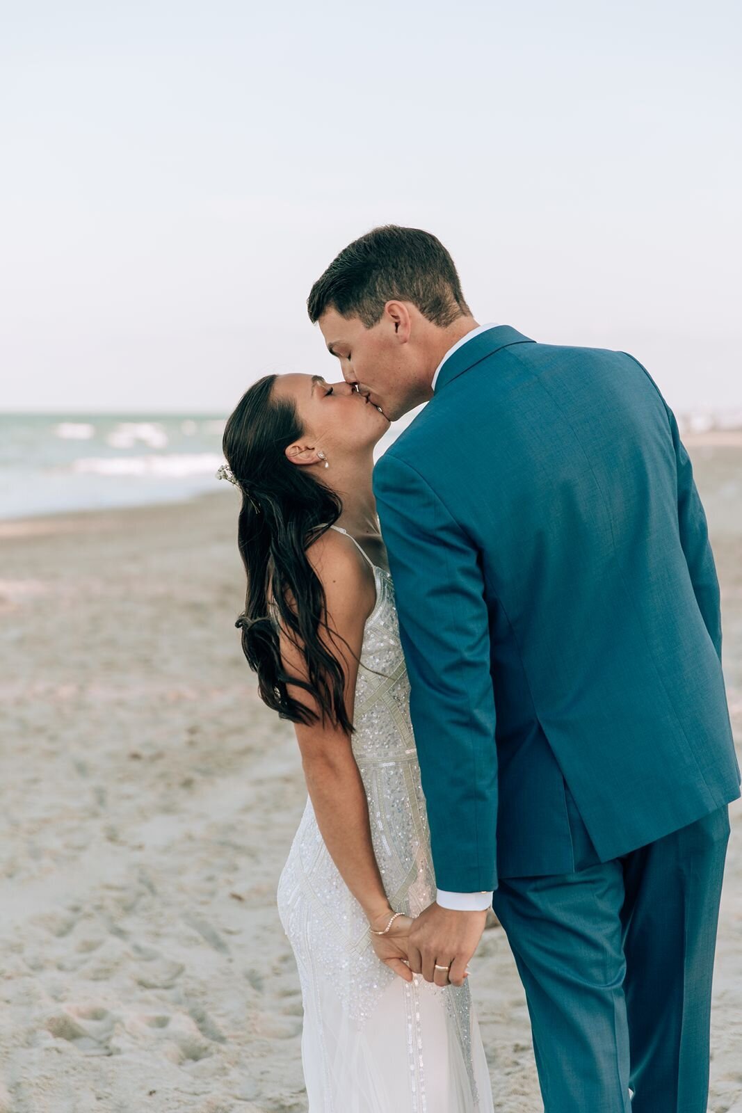 bride and groom portraits on the beach