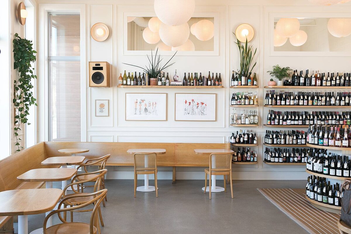 interior and seating area of a wine shop and wine bar with a casual European and French vibe