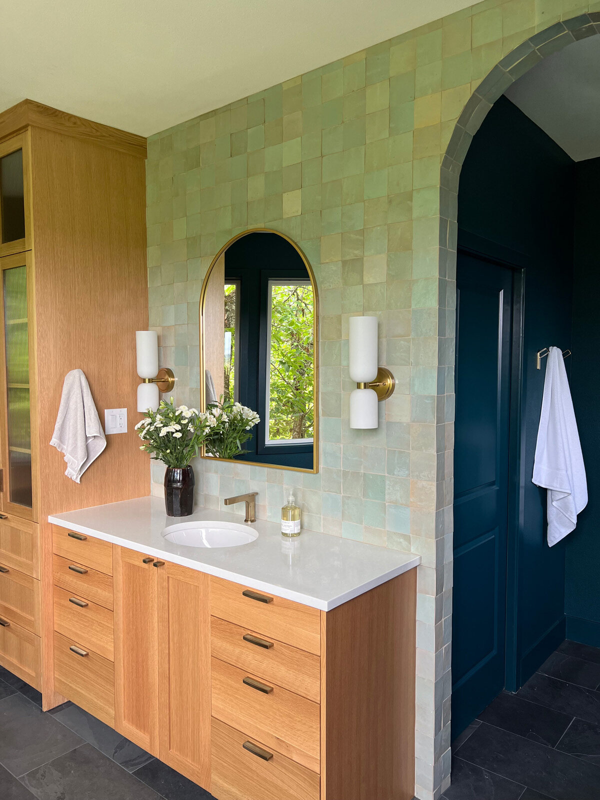 Bathroom with white oak cabinets and turquoise tile