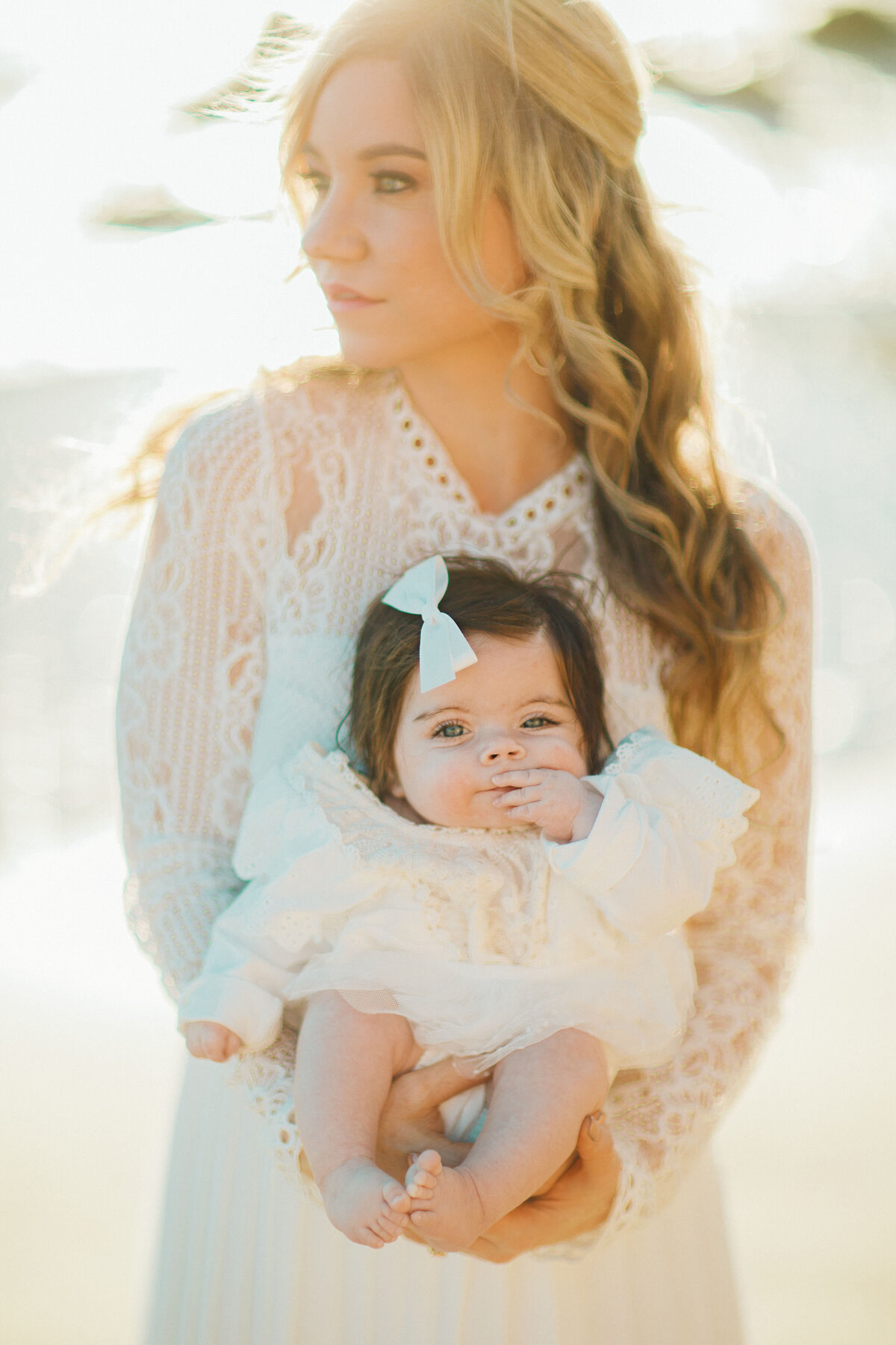 Family Portrait Photo Of Mother Carrying Her Baby In White Dress Los Angeles