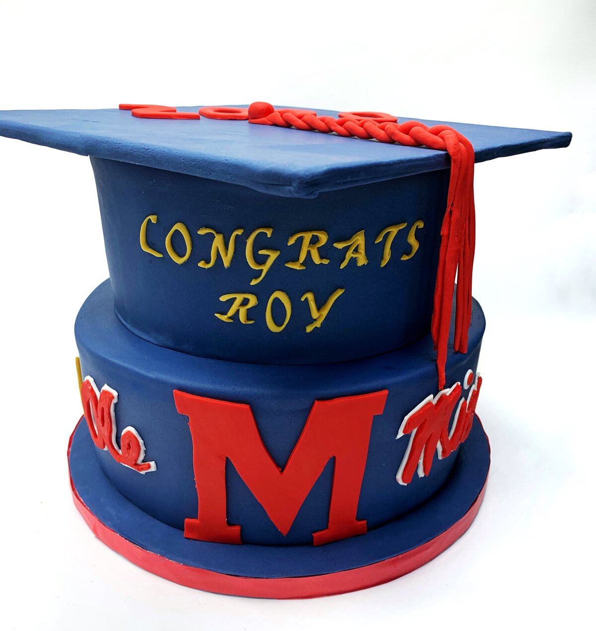 Blue and red graduation cake with fraternity and Ole Miss logos